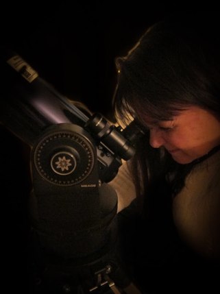 Bobbie looking through her telescope 