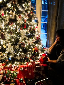 Bobbie Kogok by the Christmas Tree