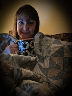 Drinking tea under my blankets
